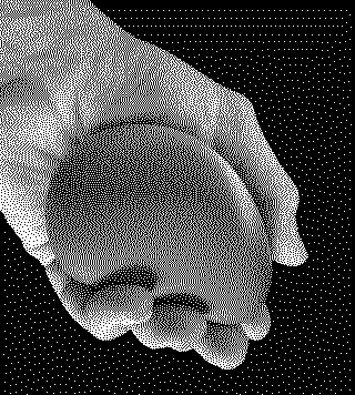 Dithered photograph of a smooth printed object resting in an open hand, from N55's IMPRACTICAL THINGS