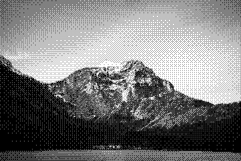 Dithered photograph of a snow-capped mountain range